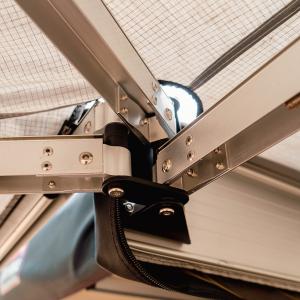 body-armor-sky-ridge-270-xl-awning-passenger-side-20027-installed-pivot-point-close.jpg